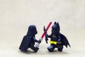 Lego darth vader fighting batman.