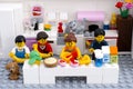 Lego family with pets in domestic kitchen