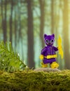 Lego female cat superhero in a purple suit in a green forest