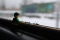 A Lego figure on the windowsill