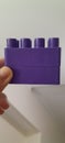 Lego and fingers purple violet stack thumb