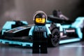 Lego Formula E Panasonic Jaguar Racing Gen2 driver minifigure by LEGO Speed Champions against his car