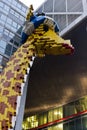 Lego giraffe in front of the Lego Discovery Centre