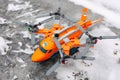 Lego heavy-duty quadrocopter with 4 spinning rotors on ice surface outdoors