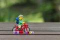 lego hiker riding bicycle with word happy life