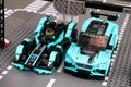 Lego Jaguar I-PACE eTROPHY and Formula E Panasonic Jaguar Racing Gen2 race cars by LEGO Speed Champions on start line