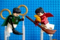 Lego Marcus Flint and Harry Potter on broom captured the Golden Snitch Royalty Free Stock Photo