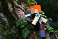 Lego Minecraft action figure of Alex mining climbing real english ivy climbing plant on tree with pickaxe