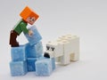 LEGO Minecraft Alex is building igloo from ice looking light blue scented stearine wax cubes, Minecraft polar bear is sniffing