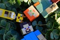 LEGO Minecraft figures of Alex, Steve and ocelot cat mob relaxing on decorative succulent plant foliage, viewed from above