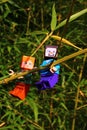 LEGO Minecraft figures of Steve and Alex main characters, climbing together on side branch of Phyllostachys bambo o plant