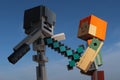 Lego Minecraft large action figure of Alex with diamond sword fighitng with skeleton in helmet. Royalty Free Stock Photo