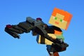 LEGO Minecraft large female figure of main character Alex holding model of Klingon battleship Bird Of Prey.