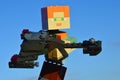 LEGO Minecraft large female figure of main character Alex holding model of Klingon battleship Bird Of Prey.