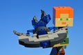 LEGO Minecraft large figure of Alex holding model of Start Trek Vulkan spaceship Jellyfish, looking forward.