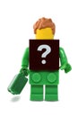 Lego minifigure green brick with black plate of question mark Royalty Free Stock Photo