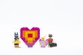 Lego minifigure character with brick of love