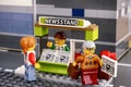 Lego newsstand with newspapers and customers