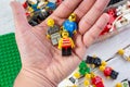 Lego people in hand