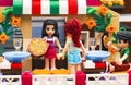 Lego Pizzeria. Waitress serves pizza for guests in restaurant Royalty Free Stock Photo