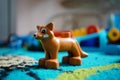 Lego plastic dog figurine on a floor