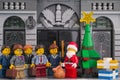 Lego Santa Claus giving gifts to businessmen