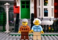 Lego senior couple opposite his house on the street.