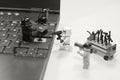 Lego star wars character assembling enter button on laptop keyboard in black and white