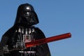 Lego Star Wars figure of Darth Vader holding red lightsaber