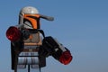 Lego Star Wars Mandalorian warrior with grey and orange armor, holding two large guns. Royalty Free Stock Photo