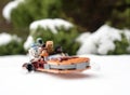 lego star wars minifigures droid r2d2 c3po lando and han solo riding on speeder during winter Royalty Free Stock Photo