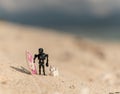 lego star wars minifogure droid k2so with dog and surfboard on the beach