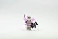 lego storm trooper wearing fairy costume holding teddy bear