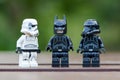 Lego stormtrooper in line one of them wearing batman mask