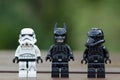 Lego stormtrooper in line one of them wearing batman mask