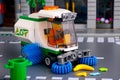 Lego Street sweeper toy truck with brushes with driver minifigure inside cleaning street