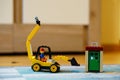 Lego toy excavator on floor