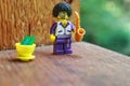 Lego Toy male figure smiling character with an afro, goatee Wearing funky glasses, with saxophone