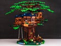 A Lego Tree House. This set with three LEGO tree house cabins and landscape base with picnic table and swing