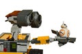 LEGO Wall-E robot from Disney Pixar movie holding small model of spherical Star Wars repair droid BB8 on his left arm