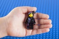 Lego Wyldstyle minifigure in child hand