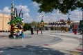 Legoland Dubai Theme Park Resort for children Lego Dragon entrance with a blue sky background and fireman statue. Luxury travel