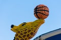 Legoland Dubai Theme Park Resort for children Lego large giraffe statue with basketball. Luxury travel resort destination Royalty Free Stock Photo