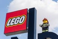 Legoland Dubai Theme Park Resort for children Lego Logo sign with a blue sky background and fireman statue. Luxury travel resort
