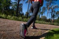 Legs of an athlete running along a park path. Outdoor sports Royalty Free Stock Photo