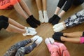 Legs of athletes woman wearing sports shoes in a circle. Top view