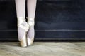 Legs of a ballerina in pointe shoes. Copy space.