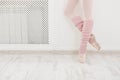 Legs of ballet dancer wearing gaiters closeup