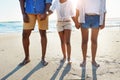 Legs, beach and a black family holding hands together while standing on the sand by the sea on summer vacation. Feet Royalty Free Stock Photo