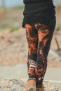 Legs in beautiful and unique cut out tights, festival fashion, golden hour, warm evening Royalty Free Stock Photo